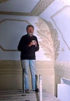 Alan Dodd working on a mural